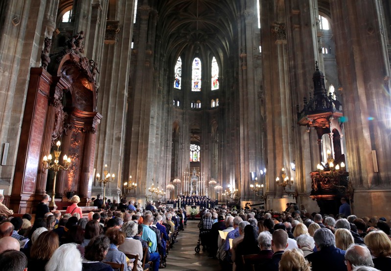 People attend Easter Sunday Mass at Saint-Eustache, days after a massive fire devastated large parts of the structure of the gothic Notre-Dame Cathedral, in Paris