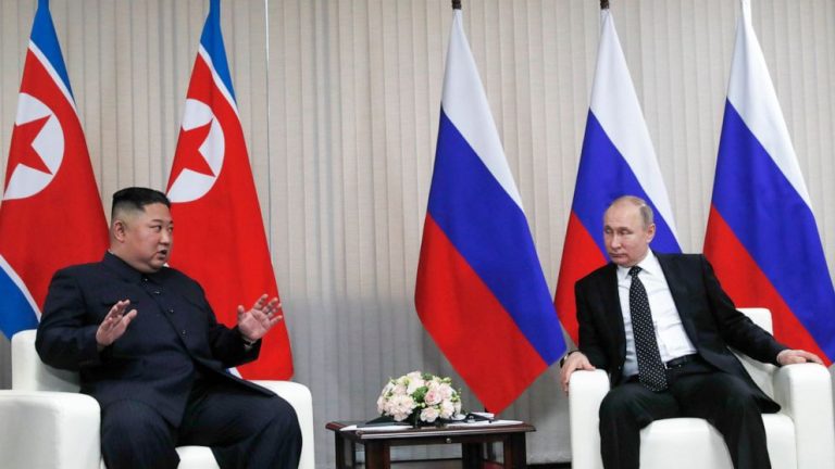 At Kim-Putin summit, hearty handshakes and manspreading