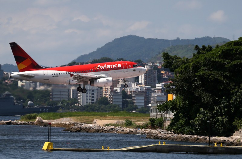 FILE PHOTO: An Airbus A318 of Avianca Brazil prepares to land at Santos Dumont airport in Rio de Janeiro