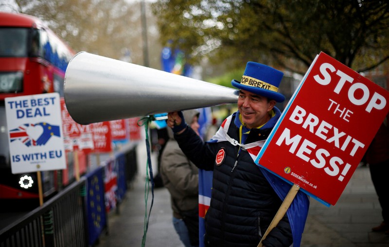 An anti-Brexit protester demonstrates outside the Houses of Parliament in London