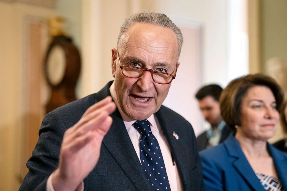 Senate Minority Leader Chuck Schumer joined at right by Sen. Amy Klobuchar speaks to reporters at the Capitol in Washington, Tuesday, April 9, 2019.