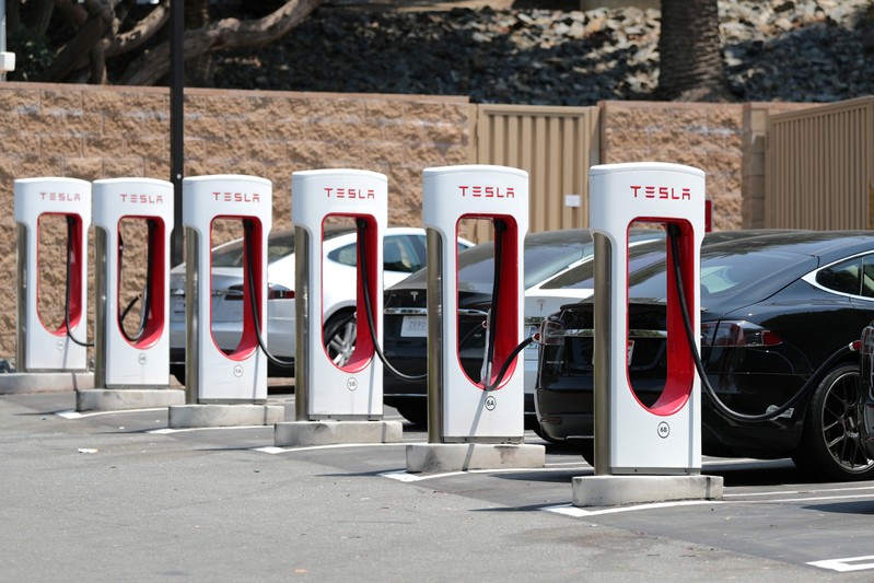 FILE PHOTO: A Tesla electric car supercharger station is seen in Los Angeles