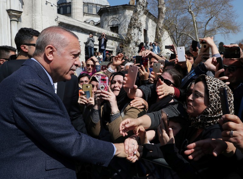 FILE PHOTO: Turkish President Erdogan is greeted by his supporters as he leaves a mosque after the Friday prayers in Istanbul