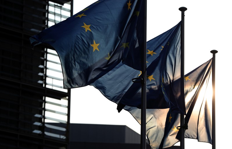 European Union flags fly outside the European Commission headquarters in Brussels