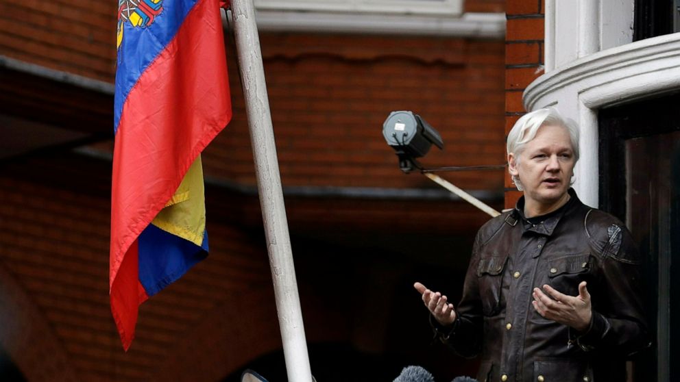 FILE - In this Friday May 19, 2017 file photo, WikiLeaks founder Julian Assange gestures as he speaks on the balcony of the Ecuadorian embassy, in London. A senior Ecuadorian official said no decision has been made to expel Julian Assange from the country's London embassy despite tweets from Wikileaks that sources had told it he could be kicked out within "hours to days." A small group of protesters and supporters gathered Thursday April 4, 2019 outside the embassy in London where Assange has resided for 12 years. (AP Photo/Matt Dunham, File)