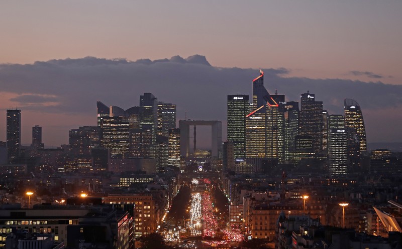 FILE PHOTO: The financial district of La Defense is seen at dusk near Paris