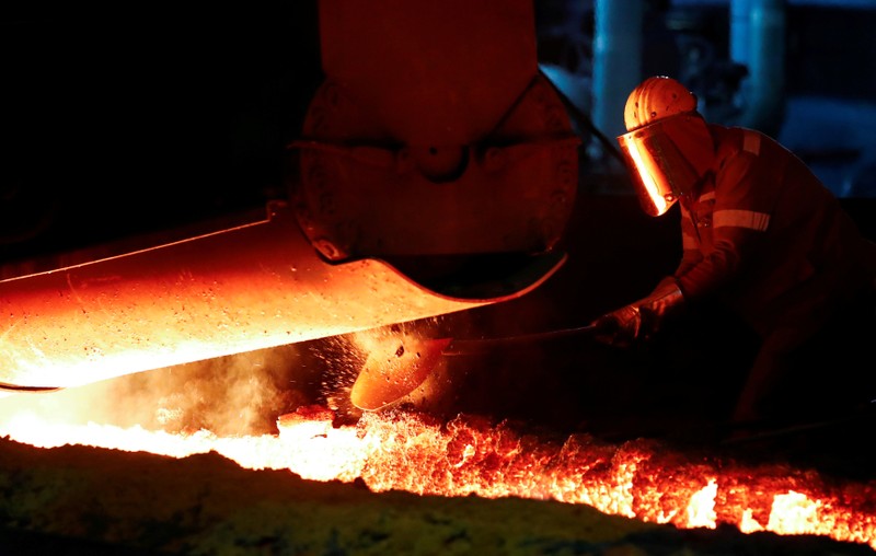 FILE PHOTO: A steel worker of Germany's industrial conglomerate ThyssenKrupp AG works near a blast furnace at Germany's largest steel factory in Duisburg