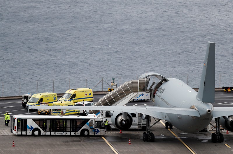 Ambulances transporting injured German tourists involved in a bus accident, arrive at a German Air Force medical airplane at Cristiano Ronaldo Airport in Funchal, on the island of Madeira