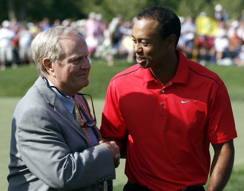 FILE PHOTO: Tiger Woods of the U.S. is congratulated by Jack Nicklaus after his final round of the Memorial Tournament at Muirfield Village Golf Club in Dublin