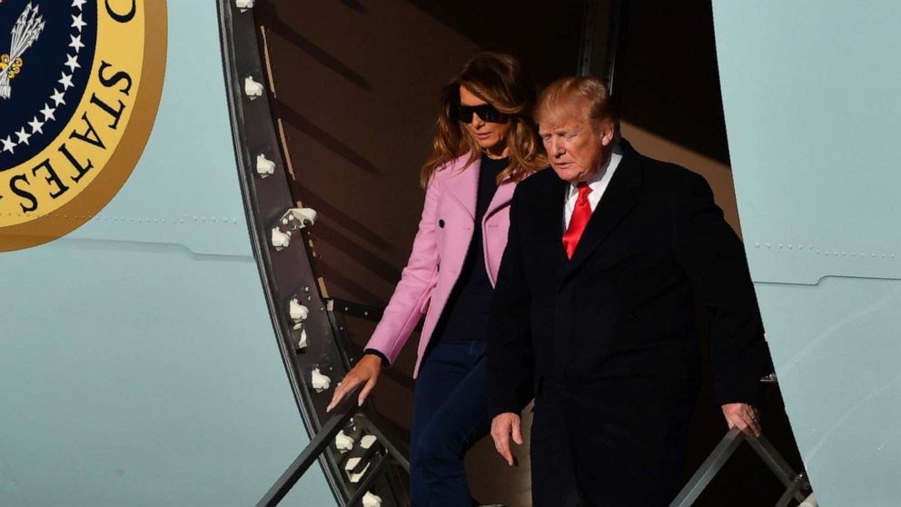 President Donald Trump and first lady Melania Trump step off Air Force One upon arrival at Andrews Air Force Base in Maryland.