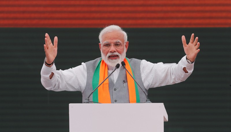 Indian Prime Minister Narendra Modi gestures as he speaks after releasing BJP's election manifesto for the April/May general election, in New Delhi