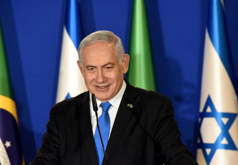 Israeli Prime Minister Benjamin Netanyahu smiles as he delivers a joint statement with Brazilian President Jair Bolsonaro in Jerusalem