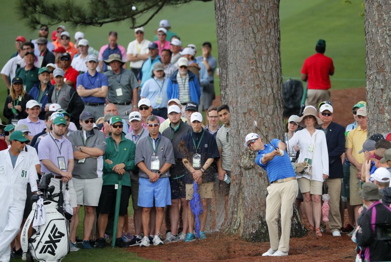 Zach Johnson of the U.S. hits from the rough on the 2nd hole during second round play of the 2019 Masters golf tournament at Augusta National Golf Club in Augusta, Georgia, U.S.