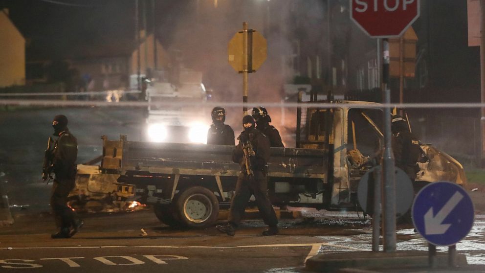 Police guard a crime scene during unrest in the Creggan area of Londonderry, in Northern Ireland, Thursday, April 18, 2019.