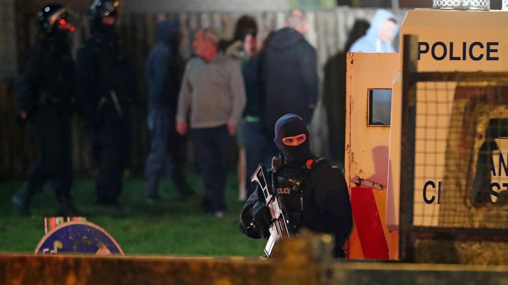 Armed police stage at the scene of unrest in Creggan, Londonderry, in Northern Ireland, Thursday, April 18, 2019.