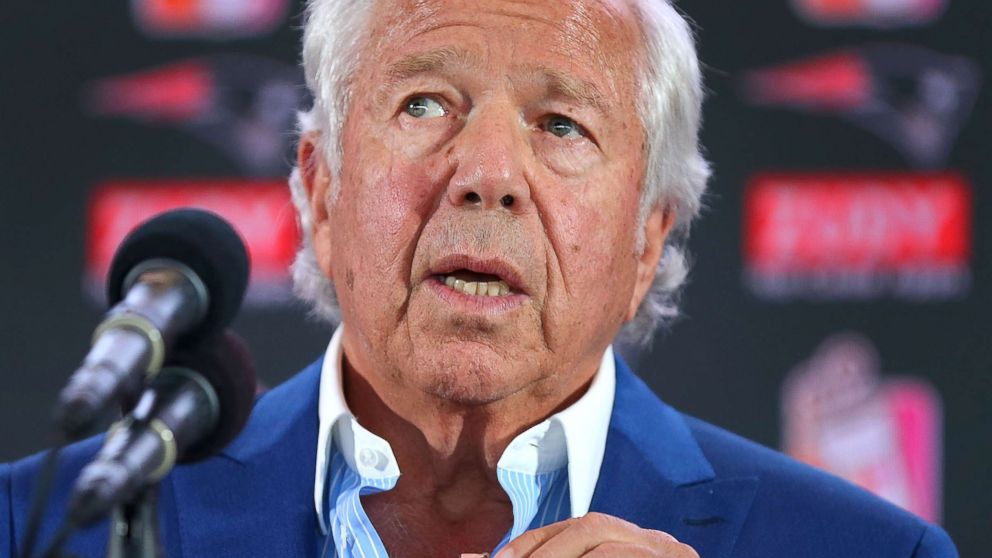 New England Patriots owner Robert Kraft holds a medal containing a wedding photo of him and his late wife Myra at a press conference in Foxborough, Mass., Aug. 9, 2017. Kraft said he wore if for 11 months straight after she died.