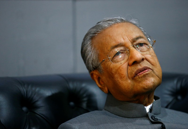 FILE PHOTO: Malaysia's Prime Minister Mahathir Mohamad reacts during an interview with Reuters in Langkawi