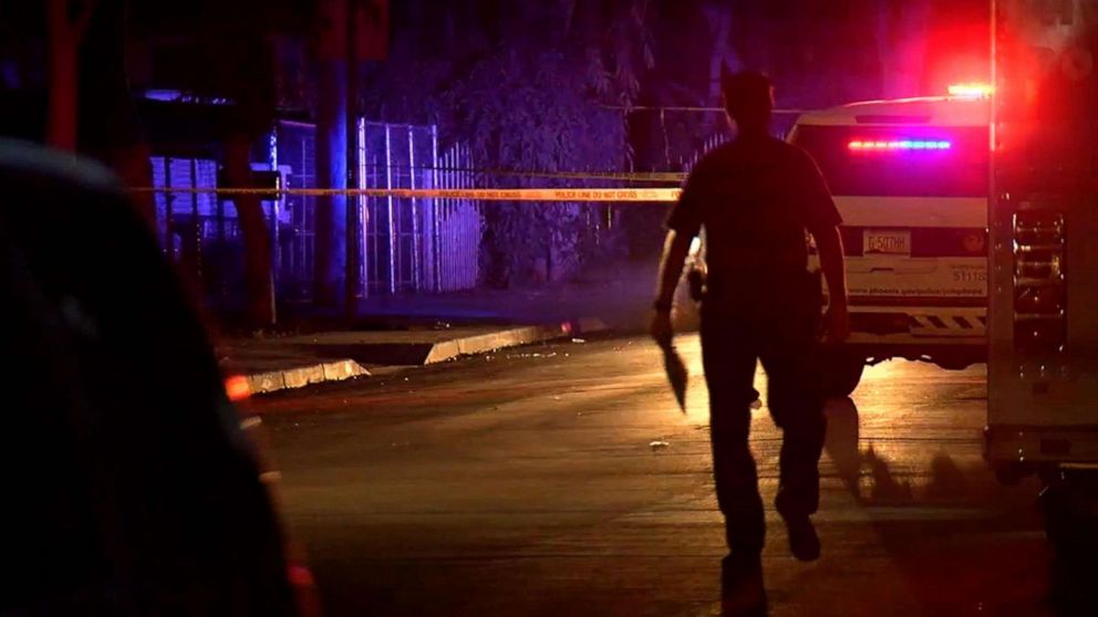 Police at the scene of a shooting in Phoenix, Ariz, April 3, 2019, following an apparent road rage shooting which killed a 10-year-old girl and injured her father.