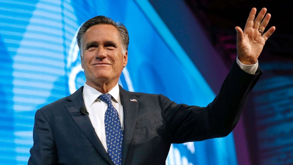 Former Republican presidential candidate Mitt Romney waves after speaking about the tech sector during an industry conference, in Salt Lake City, Jan. 19, 2018.