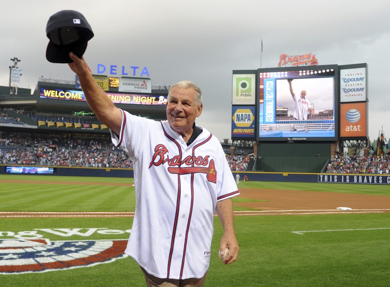 FILE PHOTO - Former Atlanta Braves manager Cox waves to the crowd after throwing out first pitch at game against the Philadelphia Phillies in Atlanta.