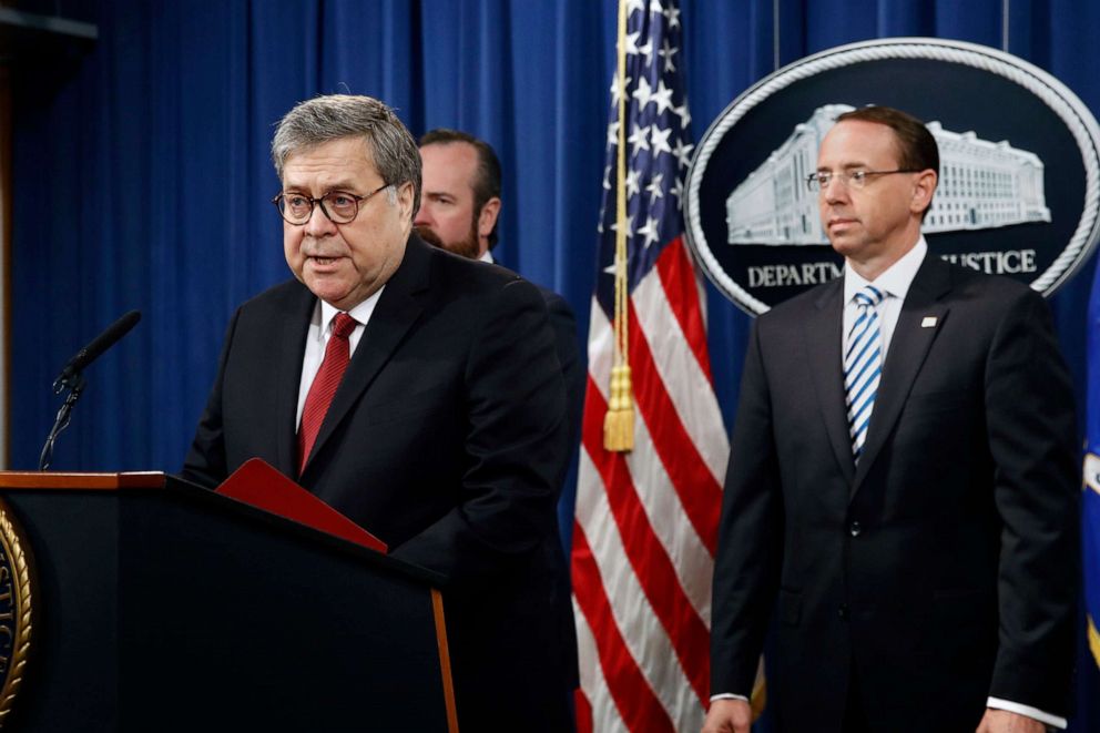 Attorney General William Barr speaks alongside Deputy Attorney General Rod Rosenstein, right, and Deputy Attorney General Ed O'Callaghan, rear left, about the release of a redacted version of special counsel Robert Mueller's report during a news conference, April 18, 2019, at the Department of Justice in Washington, D.C.
