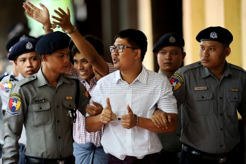 FILE PHOTO: Detained Reuters journalists Wa Lone and Kyaw Soe Oo arrive at Insein court in Yangon