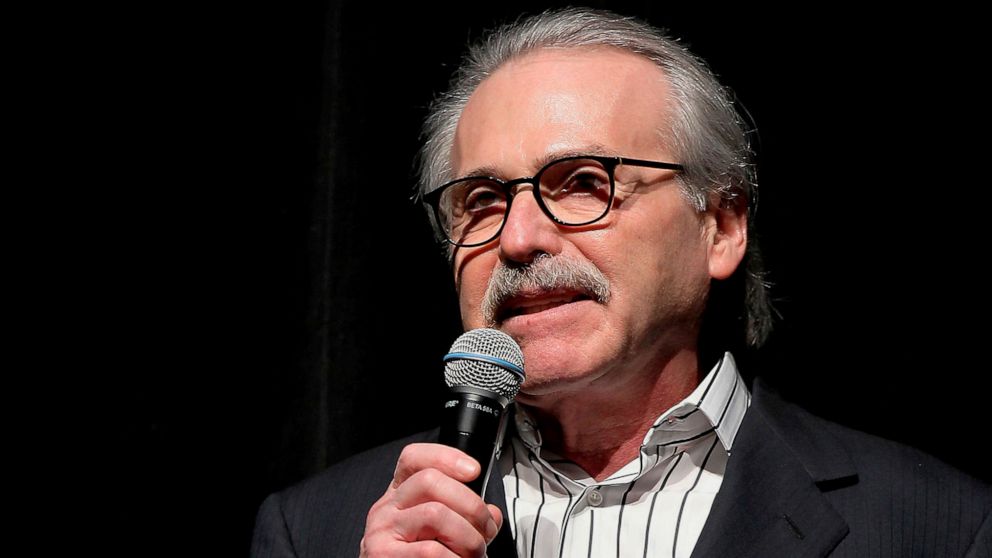 In this Jan. 31, 2014 photo, David Pecker, chairman and CEO of American Media, addresses those attending the Shape & Men's Fitness Super Bowl Party in New York. The parent company of the National Enquirer said Wednesday, April 10, 2019, that it is exploring a possible sale as part of a "strategic review" of its tabloid business. The decision by American Media comes after the tabloid said it paid $150,000 to keep Karen McDougal quiet about an alleged affair with Trump and being accused by Amazon chief Jeff Bezos of blackmail.