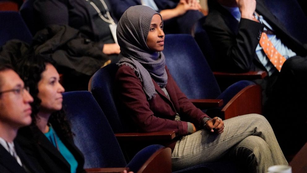 In this Nov. 15, 2018 file photo, Rep.-elect IIhan Omar, D-Minn., center, listens during member-elect orientations on Capitol Hill in Washington. A western New York man has been charged with threatening to kill U.S. Rep. Omar of Minnesota.