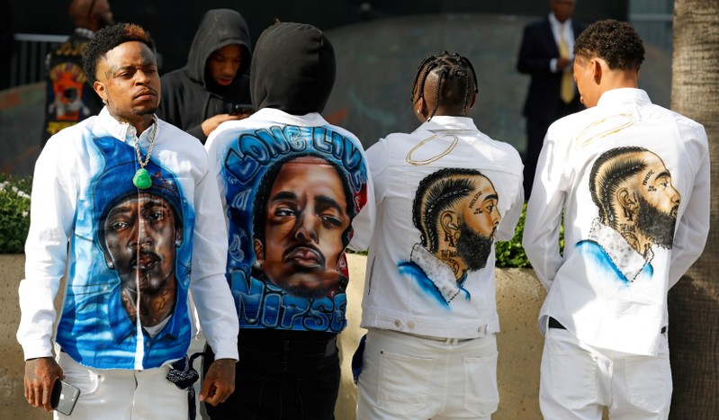 Mourners begin to arrive at Staples Center ahead of a memorial for rapper Nipsey Hussle in Los Angeles