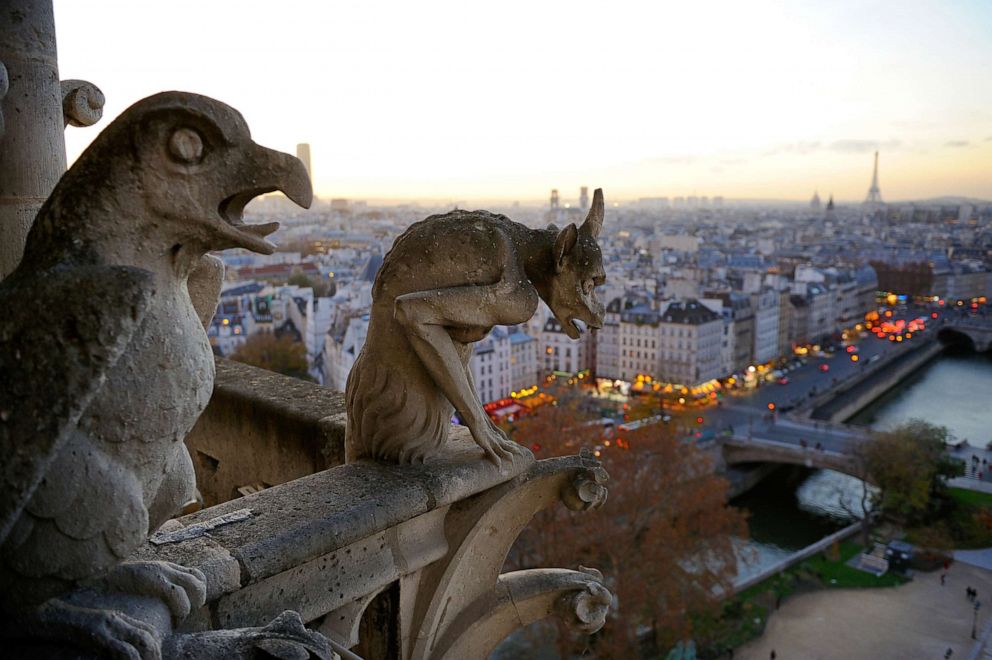Gargoyles perch on the Notre Dame Cathedral overlooking the Seine in Paris, Dec. 20, 2015.