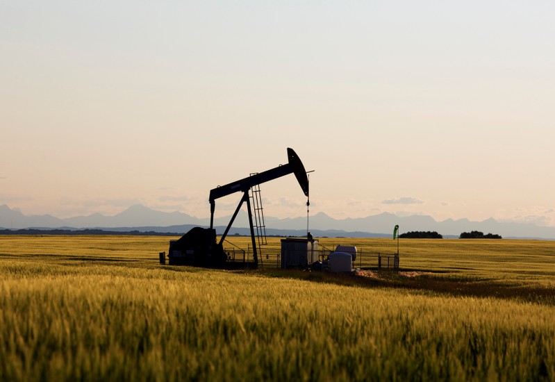 FILE PHOTO: An oil pump jack pumps oil in a field near Calgary