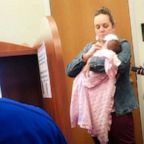 Dr. Julie George held the baby of her student, Katie Lewis, while mom took a test at UT Tyler Palestine.