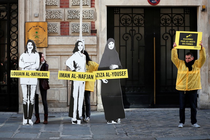 Demonstrators from Amnesty International protest outside the Saudi Arabian Embassy on International Women's day in Paris
