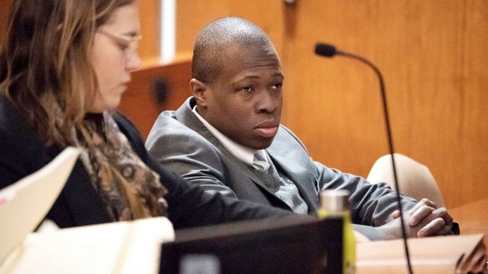 Defendant Chanel Lewis, right, is seated at the defense table at Supreme Court in the Queens Borough of New York, during the sixth day of his re-trial for the murder of Karina Vetrano, March 26, 2019.