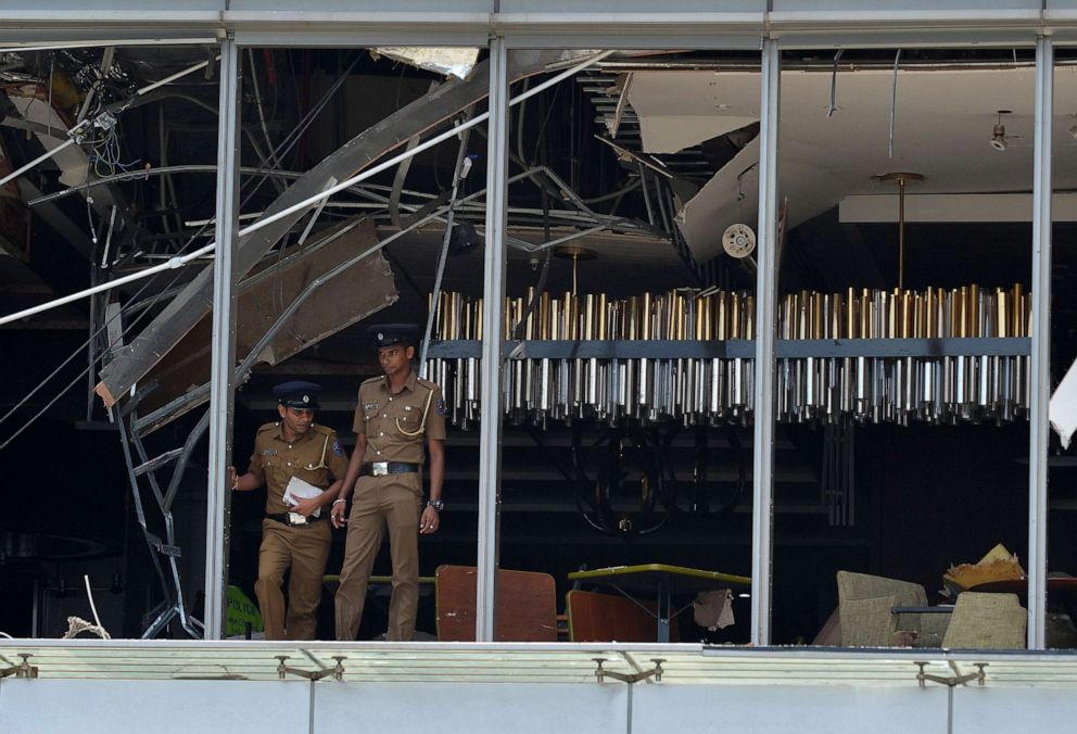 Sri Lankan police stand at the site of an explosion in a restaurant area of the luxury Shangri-La Hotel in Colombo, Sri Lanka, April 21, 2019.