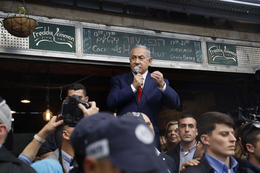 Israeli Prime Minister Benjamin Netanyahu, leader of the Likud party, addresses his supporters at the main market of Jerusalem, April 8, 2019, a day ahead of the electoral polls.