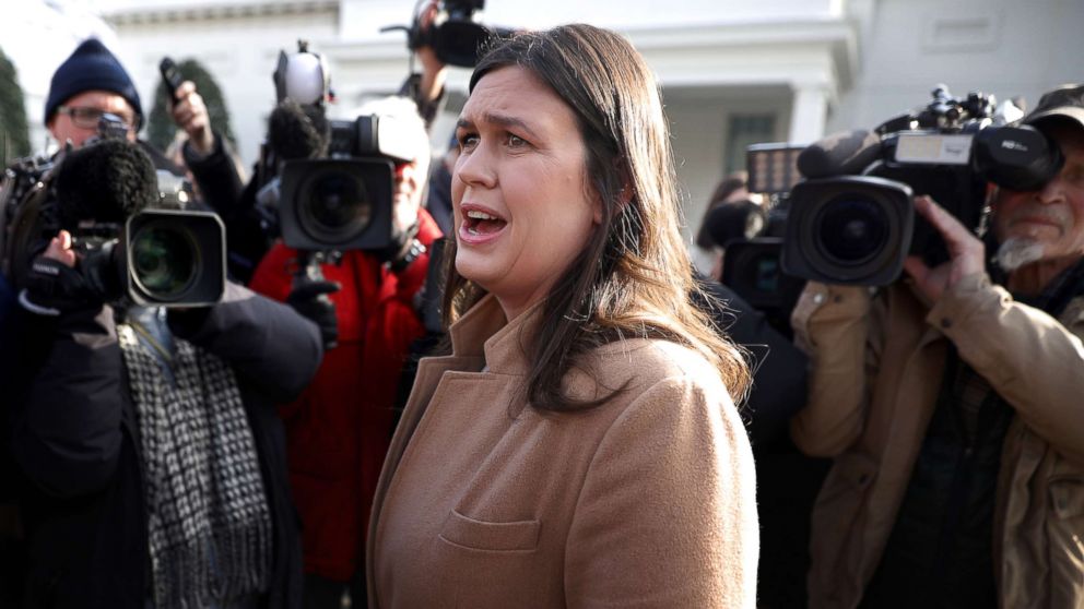 White House Press Secretary Sarah Huckabee Sanders talks to reporters outside the West Wing of the White House, Jan. 18, 2019.