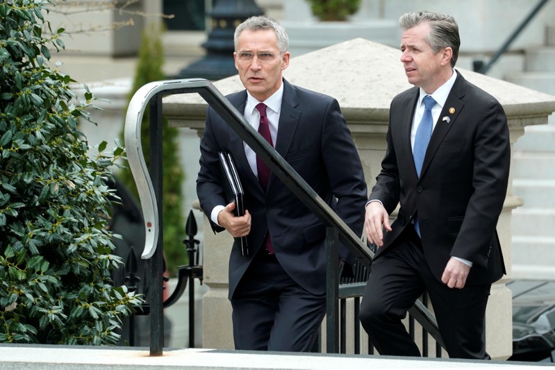 NATO's Stoltenberg is escorted as he arrives to meet with U.S. President Trump at the White House in Washington