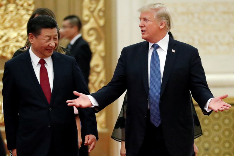 FILE PHOTO: U.S. President Trump and China's President Xi Jinping arrive for a state dinner at the Great Hall of the People in Beijing
