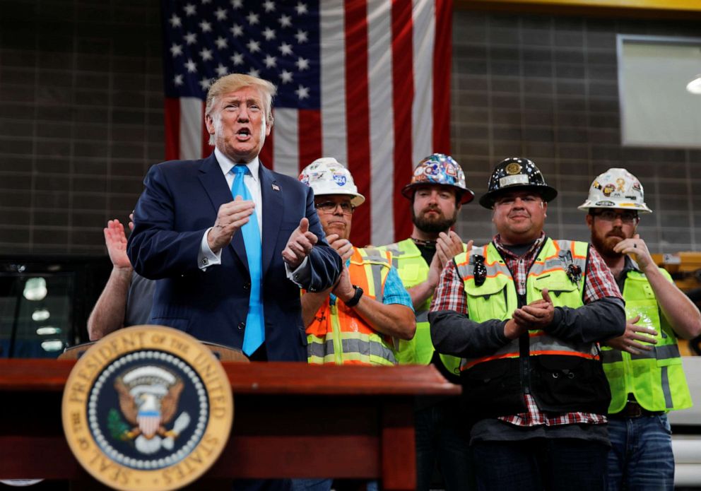 President Donald Trump is applauded prior to signing an executive order on energy and infrastructure during a campaign event at the International Union of Operating Engineers International Training and Education Center in Crosby, Texas, April 10, 2019.