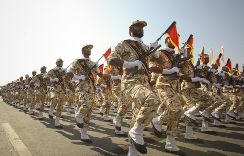 FILE PHOTO - Members of Iranian revolutionary guard march during parade to commemorate anniversary of Iran-Iraq war, in Tehran
