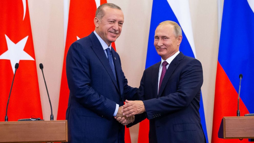 Russian President Vladimir Putin and Turkish President Recep Tayyip Erdogan shake hands after their joint news conference in Sochi, Russia, Sept. 17, 2018.