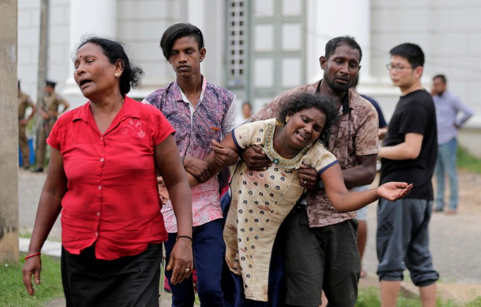 Relatives of a blast victim grieve outside a morgue in Colombo, Sri Lanka, April 21, 2019.