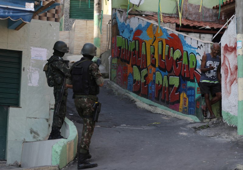 FILE PHOTO: Brazilian soldiers patrol in the Complexo da Penha slum in Rio de Janeiro
