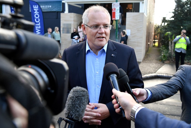 FILE PHOTO: Australian Prime Minister Morrison speaks to the media as he arrives at the Horizon Church in Sutherland