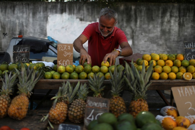 A vendor displays fruits at a street market in Rio de Janeiro