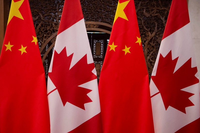 FILE PHOTO: Picture of Canadian and Chinese flags taken prior to the meeting with Canada's Prime Minister Justin Trudeau and China's President Xi Jinping at the Diaoyutai State Guesthouse