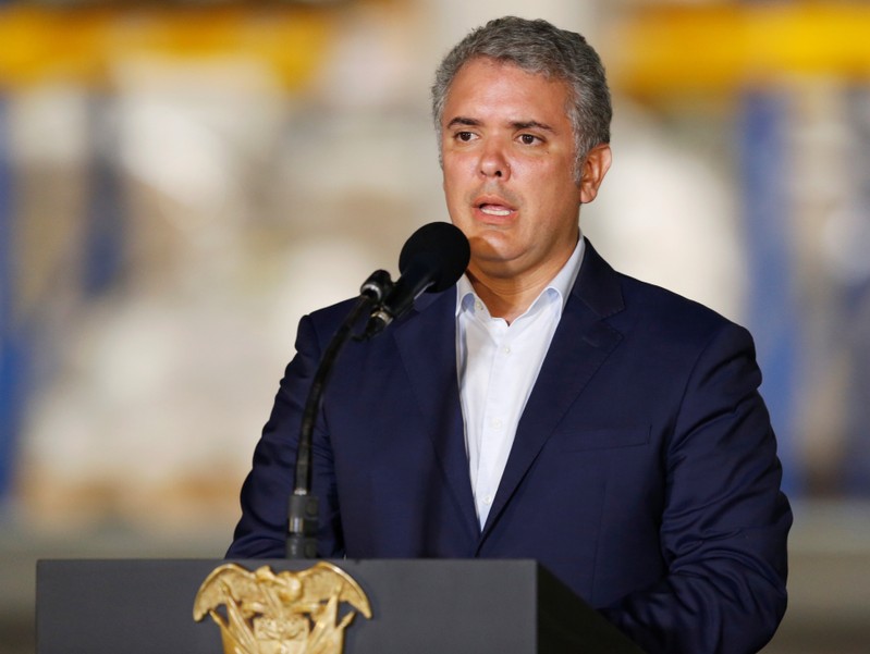 Colombia’s President Ivan Duque speaks during a news conference at a warehouse where international humanitarian aid for Venezuela is being stored, in Cucuta