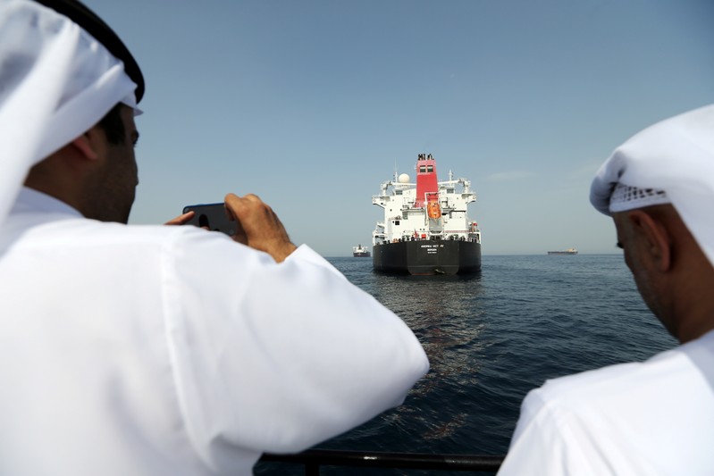 FILE PHOTO: Port officials take a photo of the damaged tanker Andrea Victory at the Port of Fujairah