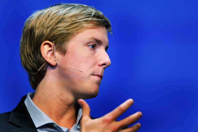 FILE PHOTO: Chris Hughes, co-founder of Facebook, speaks at the Charles Schwab IMPACT 2010 conference in Boston